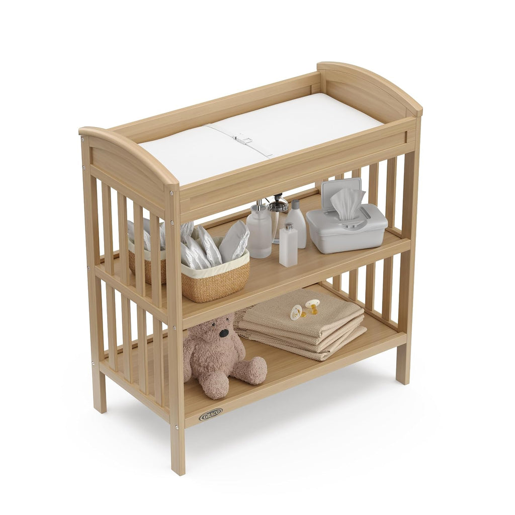 Graco Benton Changing Table with Bonus Water-Resistant Changing Pad (Driftwood) - GREENGUARD Gold Certified, Includes Diaper Change Pad with Safety Strap, 2 Open Storage Shelves for Organizing