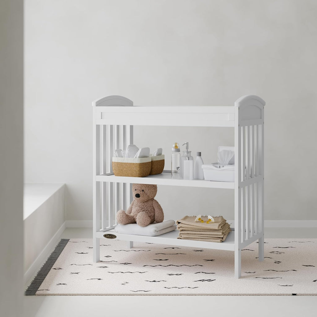 Graco Benton Changing Table with Bonus Water-Resistant Changing Pad (White) - GREENGUARD Gold Certified, Includes Diaper Change Pad with Safety Strap, 2 Open Storage Shelves for Organizing
