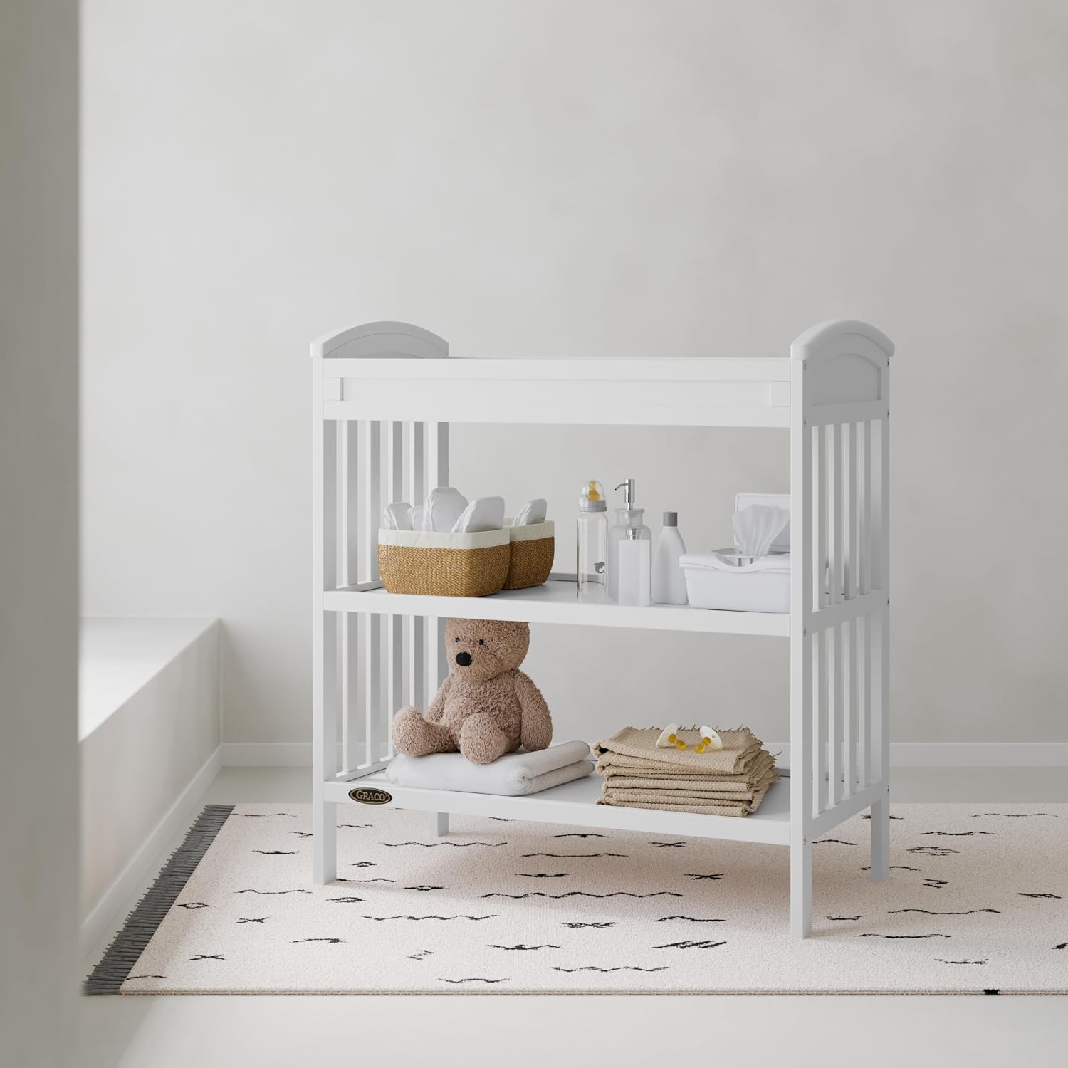 Graco Benton Changing Table with Bonus Water-Resistant Changing Pad (White) - GREENGUARD Gold Certified, Includes Diaper Change Pad with Safety Strap, 2 Open Storage Shelves for Organizing