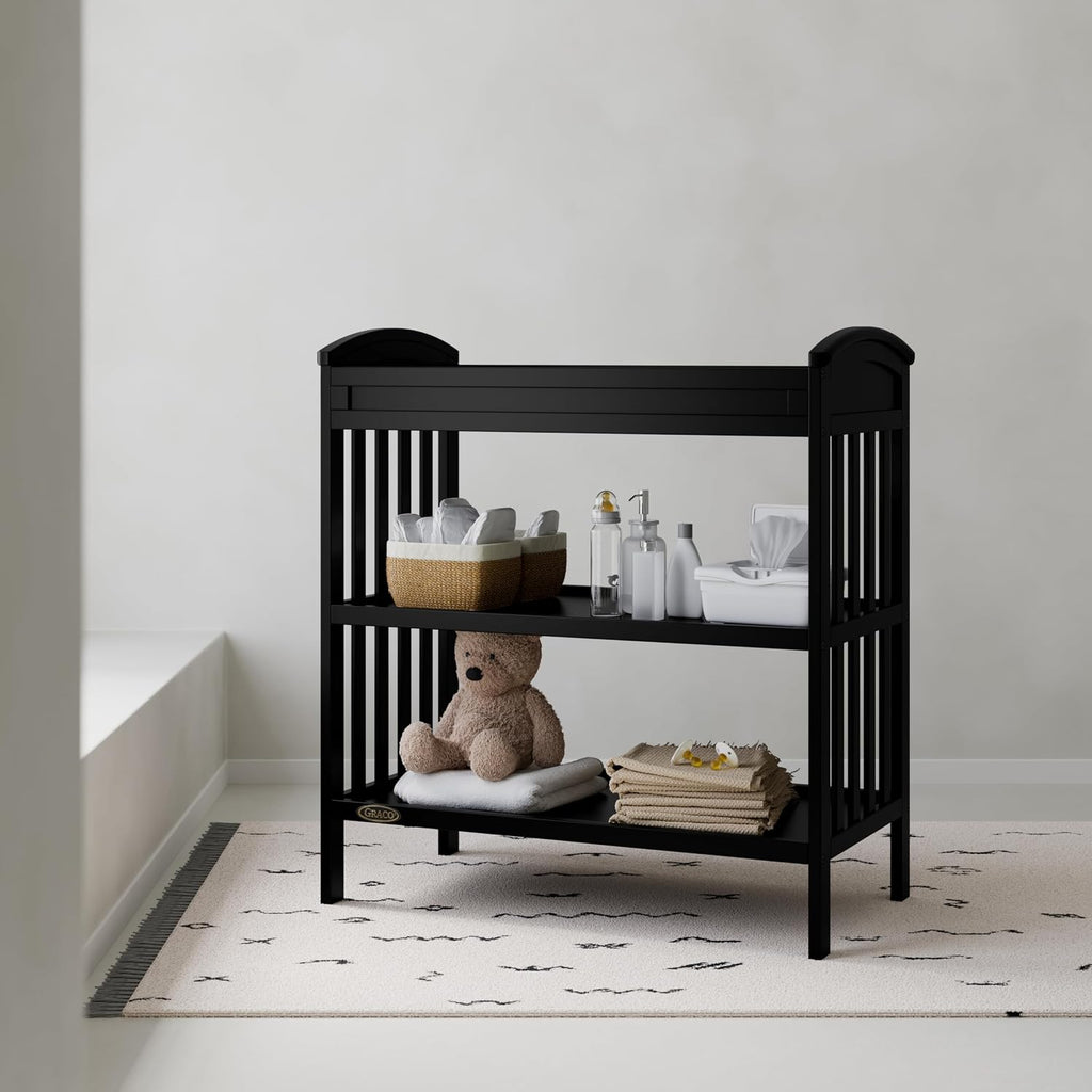 Graco Benton Changing Table with Bonus Water-Resistant Changing Pad (Black) - GREENGUARD Gold Certified, Includes Diaper Change Pad with Safety Strap, 2 Open Storage Shelves for Organizing