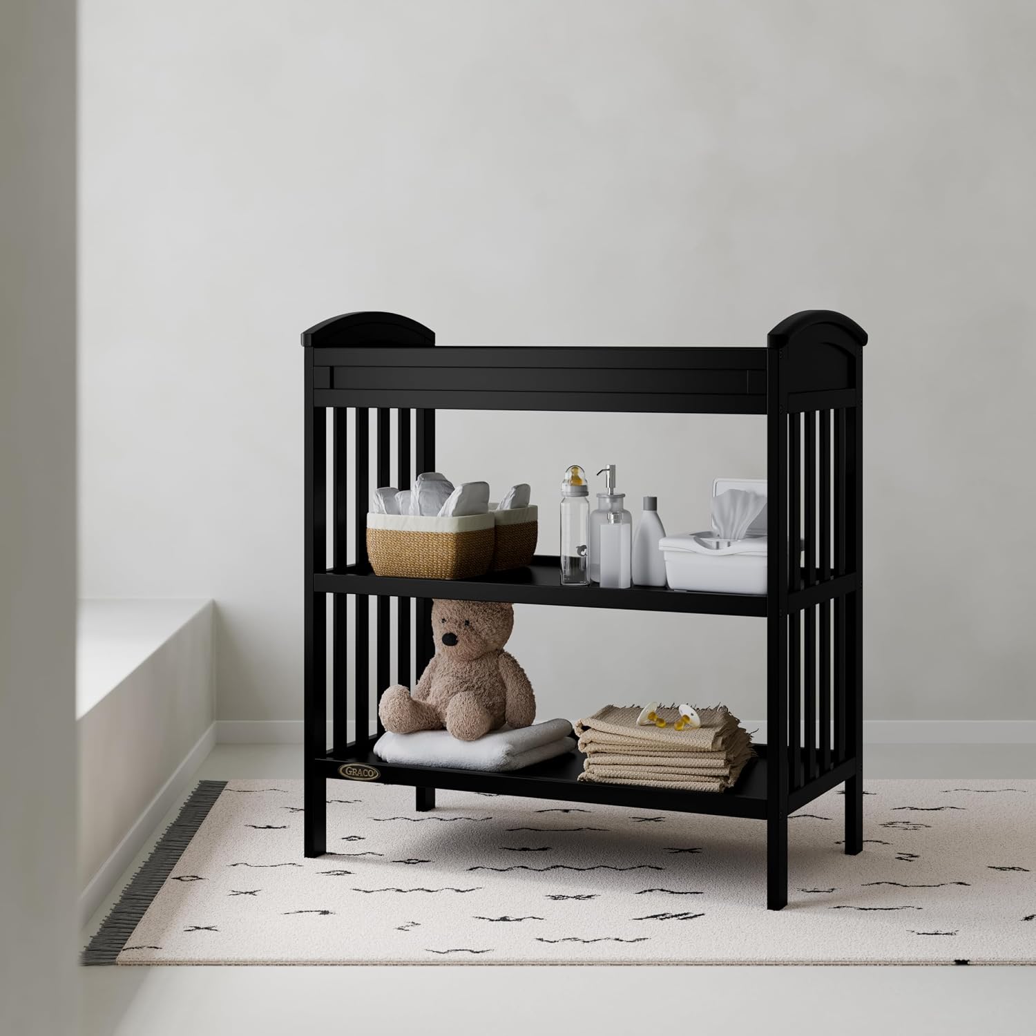 Graco Benton Changing Table with Bonus Water-Resistant Changing Pad (Black) - GREENGUARD Gold Certified, Includes Diaper Change Pad with Safety Strap, 2 Open Storage Shelves for Organizing