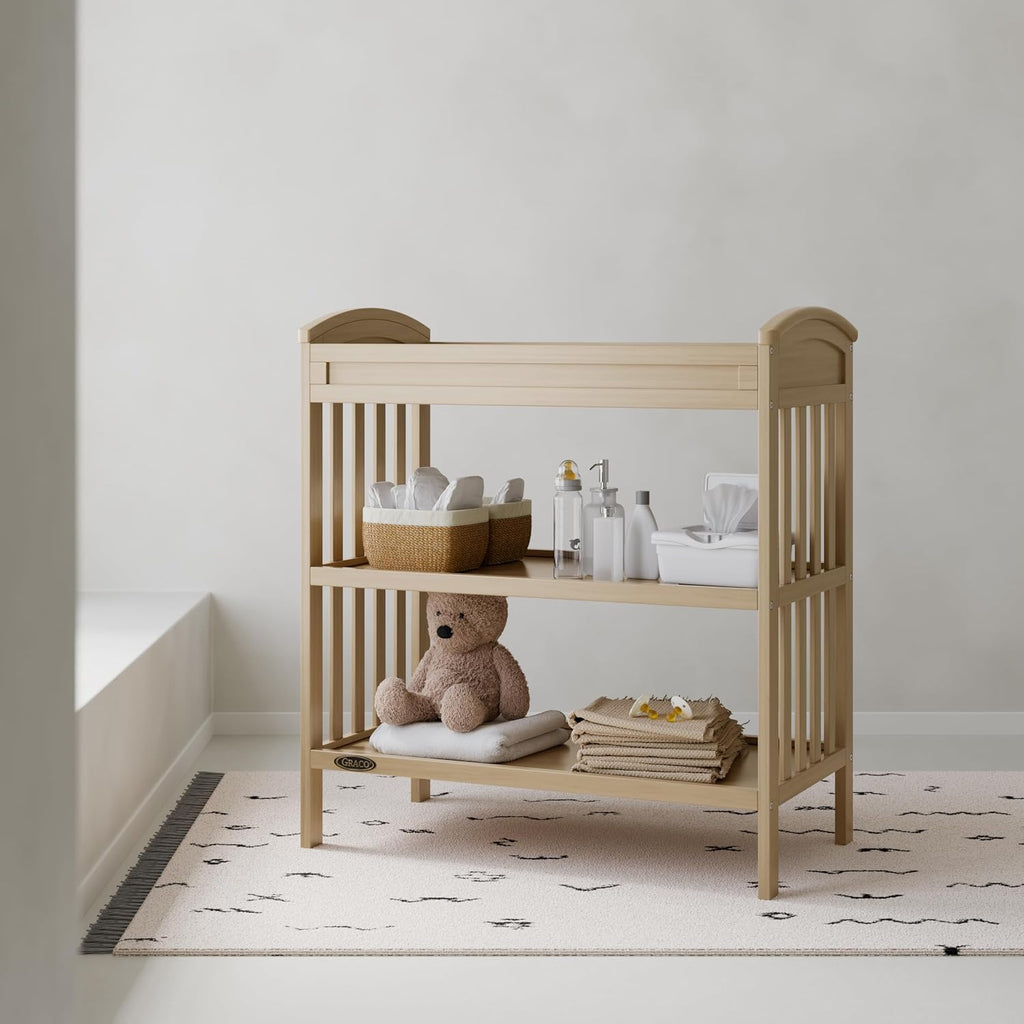 Graco Benton Changing Table with Bonus Water-Resistant Changing Pad (Driftwood) - GREENGUARD Gold Certified, Includes Diaper Change Pad with Safety Strap, 2 Open Storage Shelves for Organizing