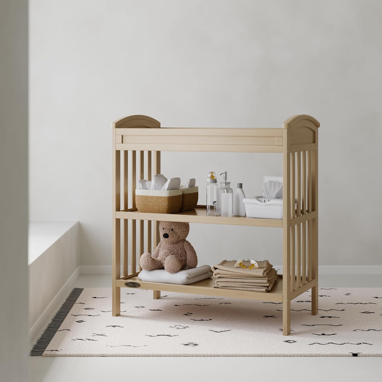 Graco Benton Changing Table with Bonus Water-Resistant Changing Pad (Driftwood) - GREENGUARD Gold Certified, Includes Diaper Change Pad with Safety Strap, 2 Open Storage Shelves for Organizing